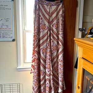 This is a beautiful strapless flow jumpsuit. Made  by Free People